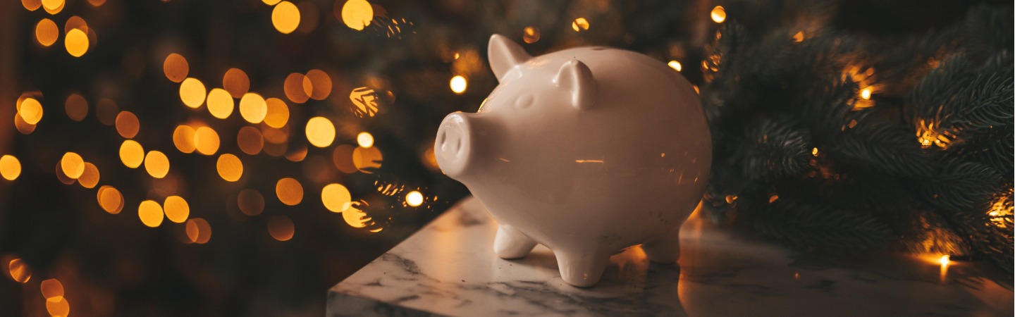 piggy-bank-in-festive-new-year-atmosphere-of-scenery-magical-bokeh-with-christmas-tree-and.jpg_s=1024x1024&w=is&k=20&c=KrthSvGhiuAetR4Y-THdb6l9HV0aWVkEnvstkBMnFwk=